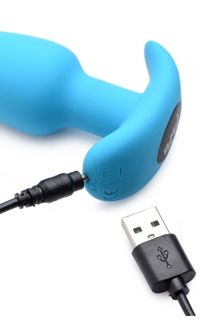 A blue device with a black cordDescription automatically generated