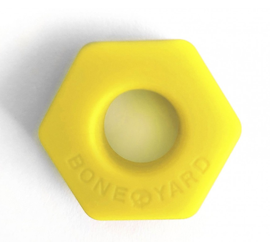 A yellow hexagon shaped object with a holeAI-generated content may be incorrect.