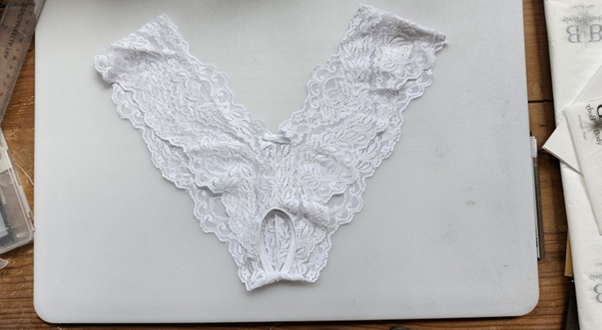 A white underwear on a white surfaceAI-generated content may be incorrect.